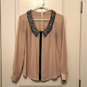 Pale pink button up with pearl and crystal embellishment.